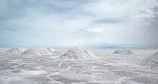 salt flats in the desert with a blue sky